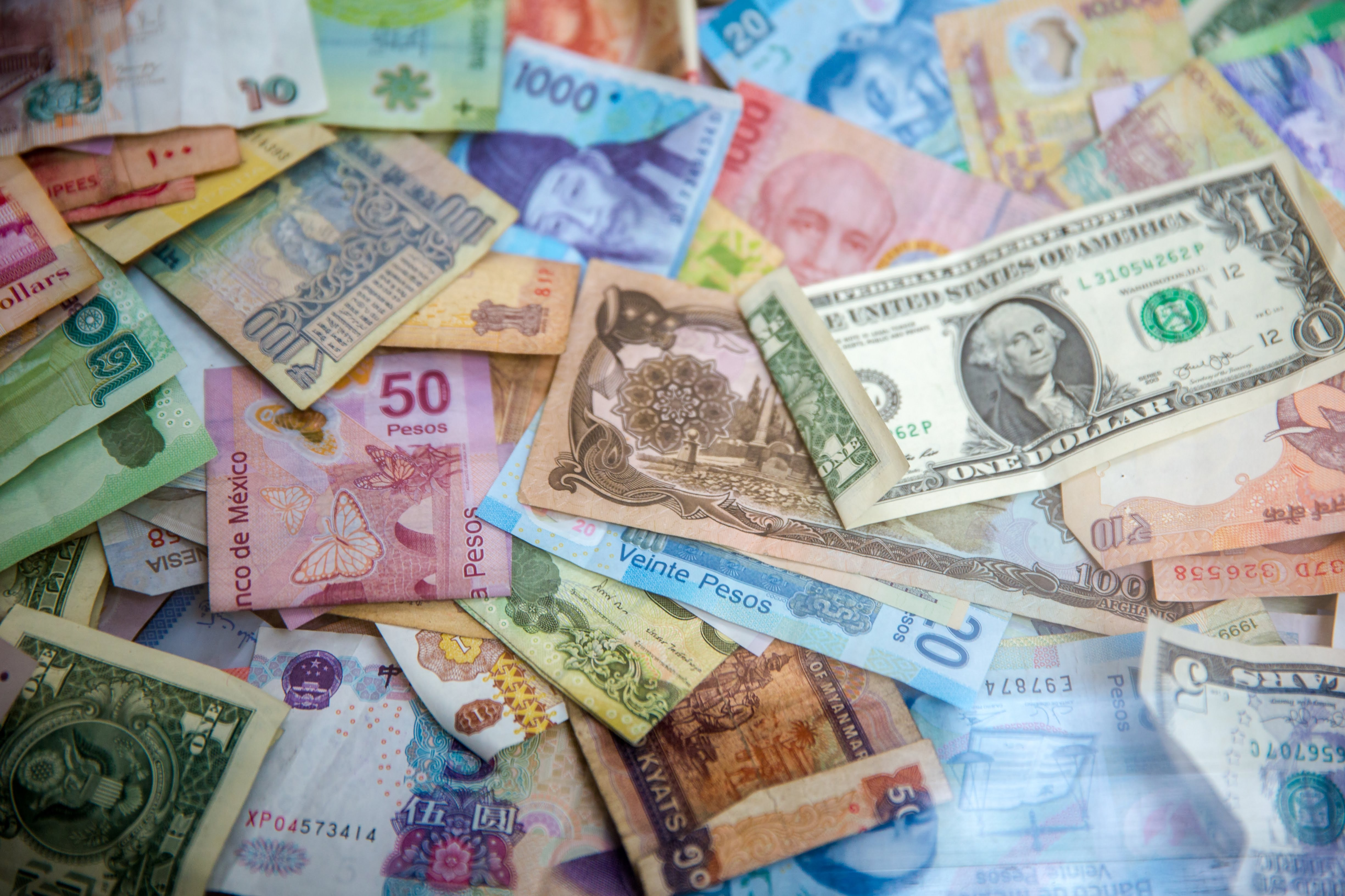 image of unsorted money in many different currencies